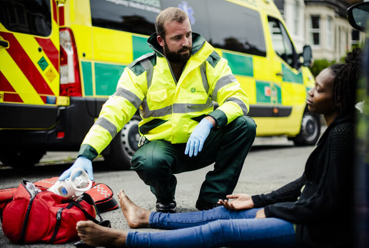 First responder EMT working on patient